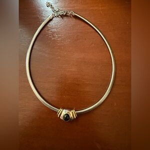 Silver tone 16" choker with silver, gold and black slide.